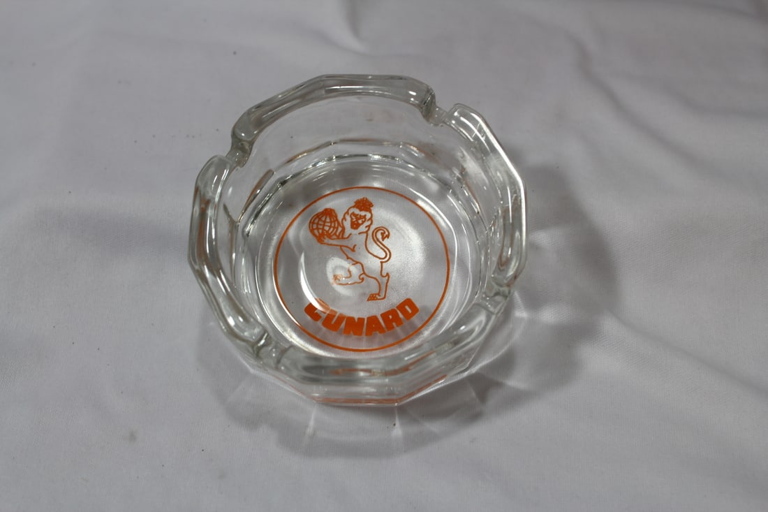 An Advertising Glass Ashtray - "Cunard": 4" in diameter - please note: chip