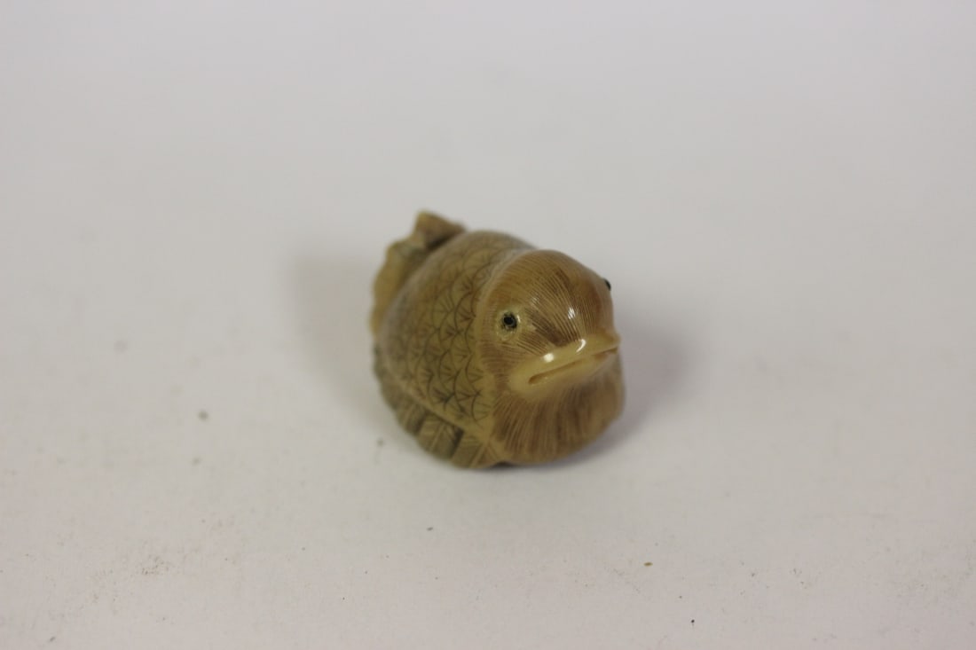 A Finely Carved Japanese Tagua Nut Netsuke: 1 3/4" in length