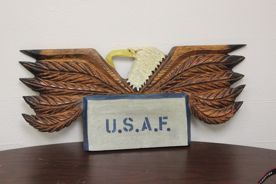An Eagle Plaque: wood construction - please note: on chip on the wing as shown - 32 inches across