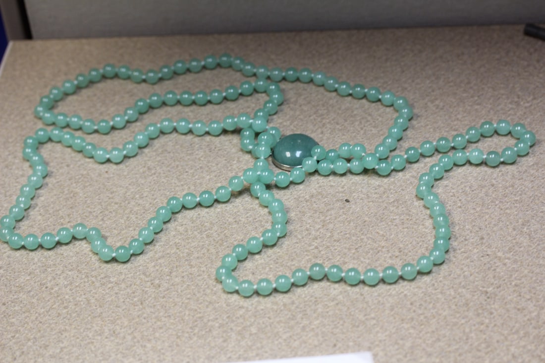 Jade necklace: triple strand, approximately 12" long when clasped