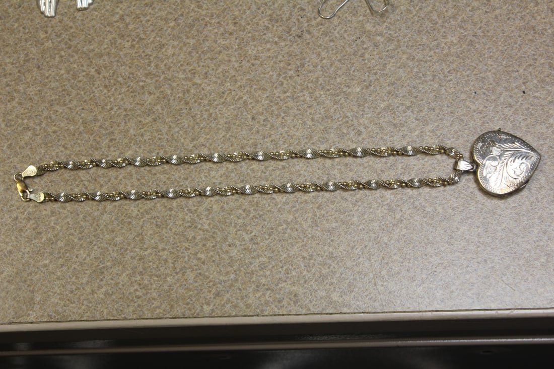 Marked 925 Sterling Locket Necklace: approximately 9" long when clapsed