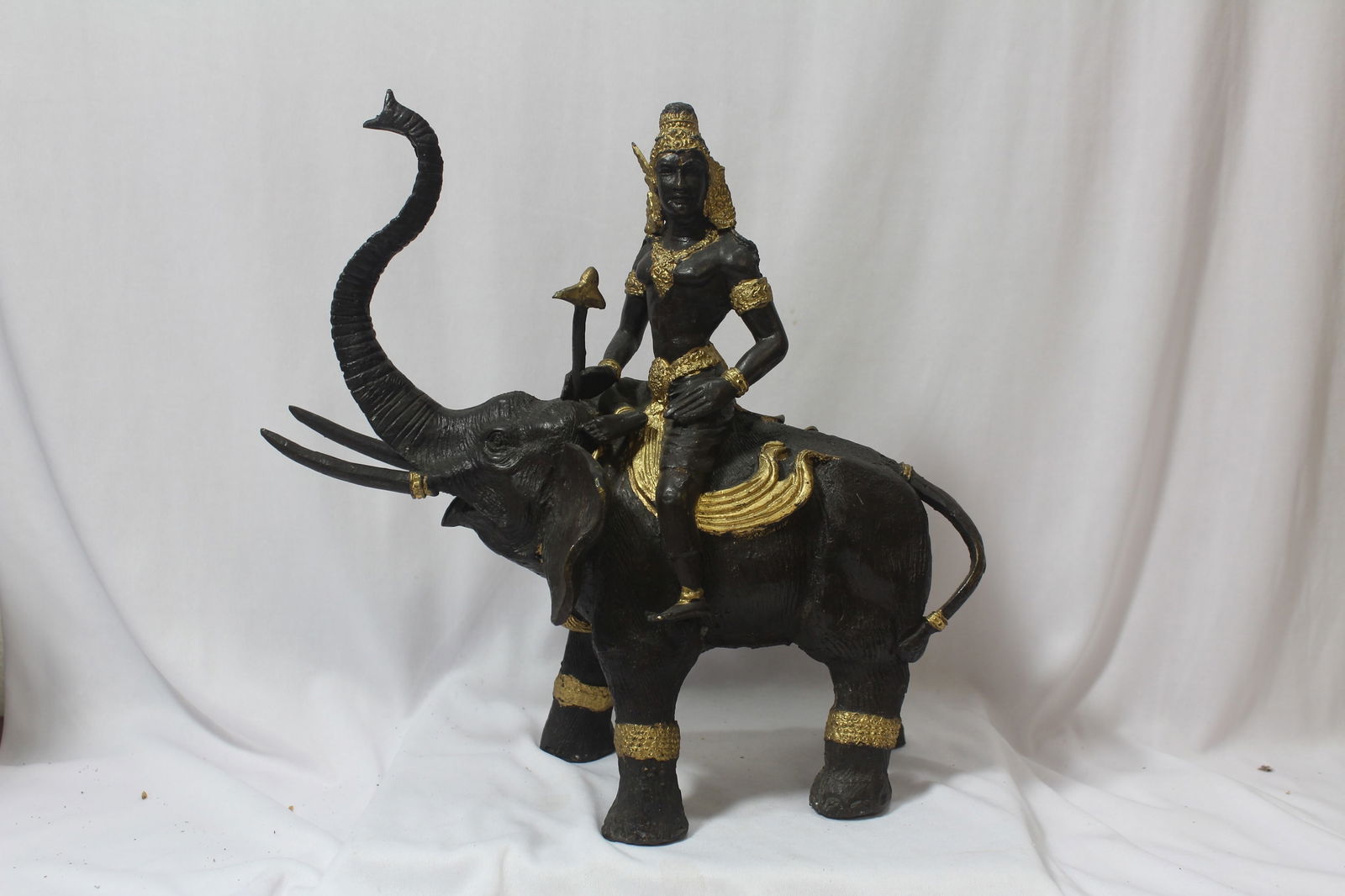 A Bronze Elephant with Rider: it is heavy - please note: chip as shown - 12" wide
