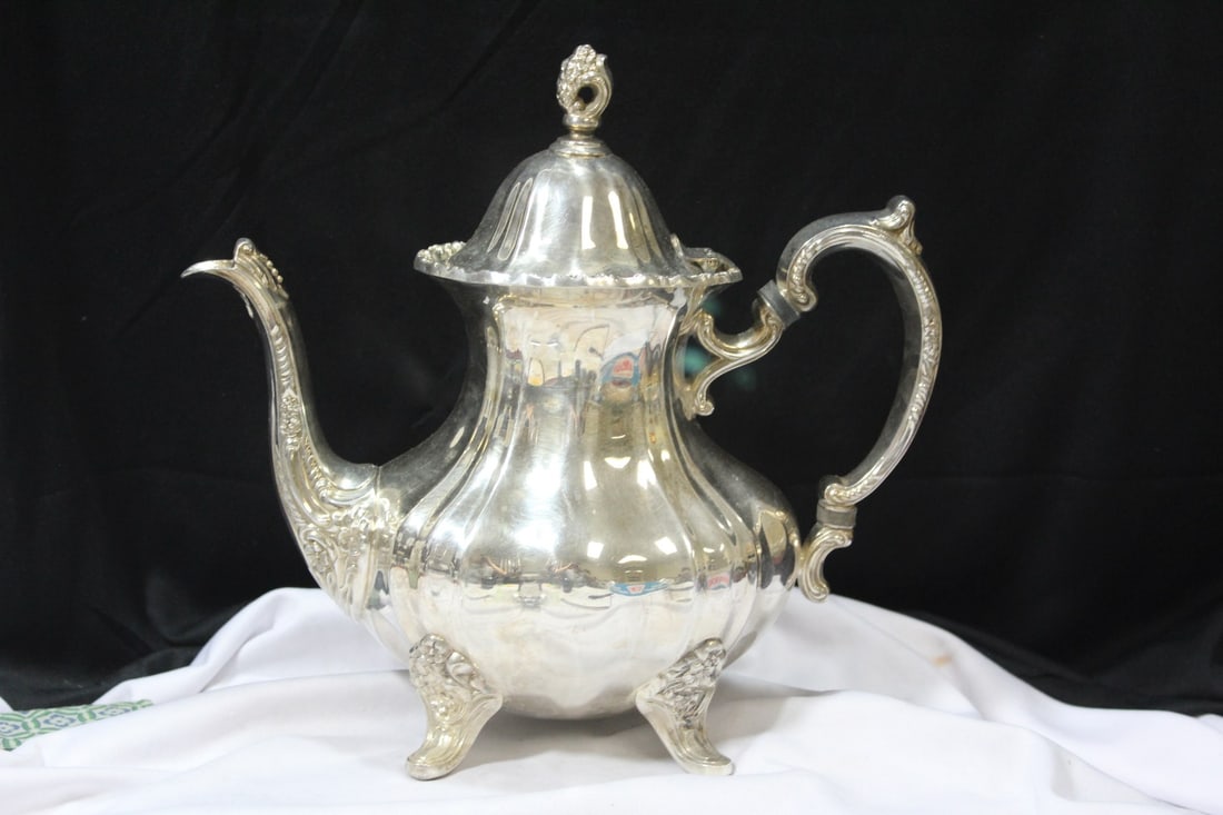 A Silverplated Teapot: ornate - 10 1/2" across