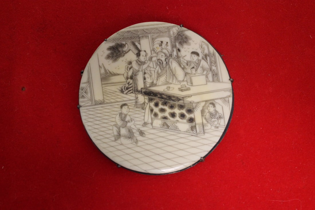 A Sterling and Carved Bone Brooch: marked China - with maker's mark on the rim - 2 1/2" in diameter