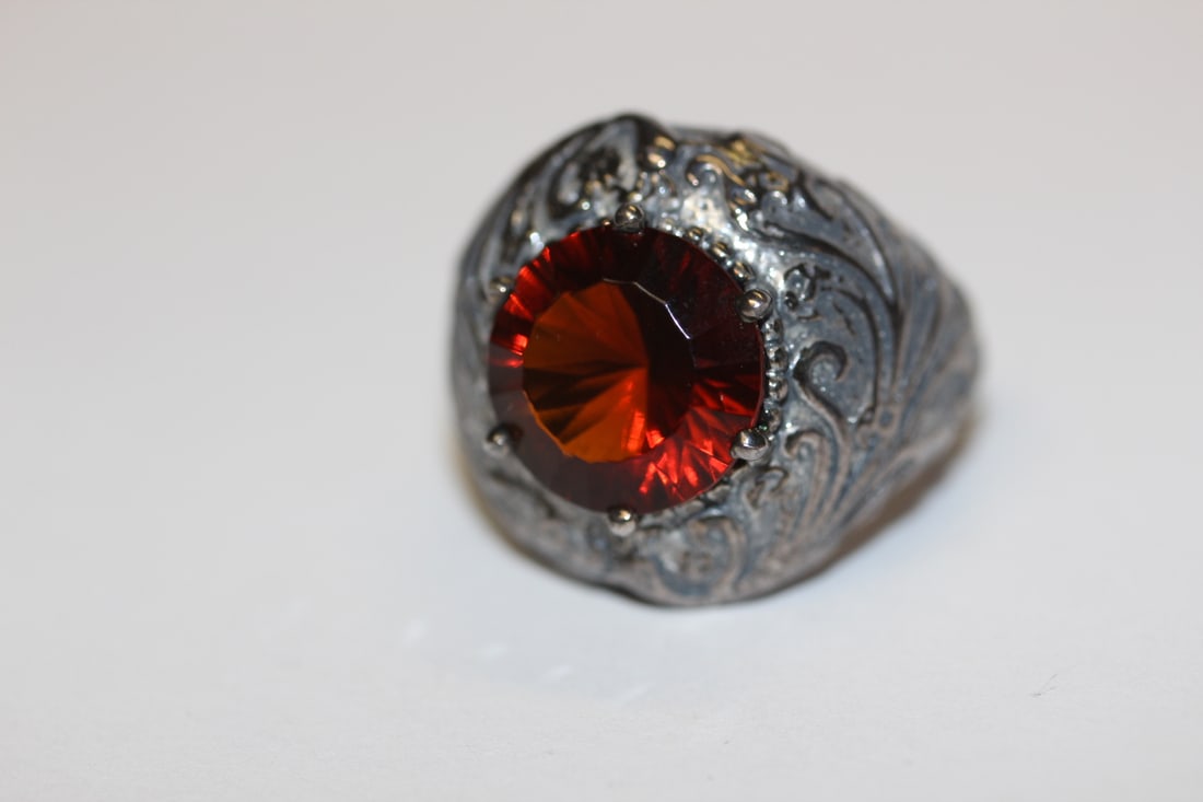 A Sterling and Red Stone Ring: as shown