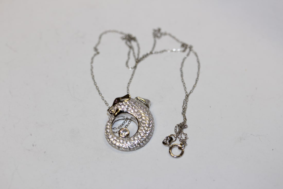 A Sterling Necklace and Pendant: measures 9 1/2" in overall when clapsed