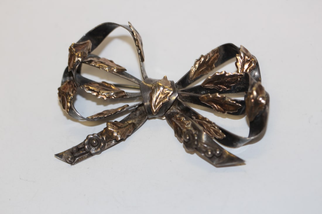 A Sterling Bow Brooch: marked HOBE - real 14Kt - approximately 2" across