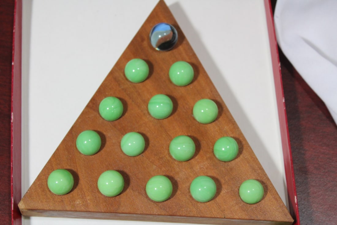 A Triangular Peg Solitaire Game - 2