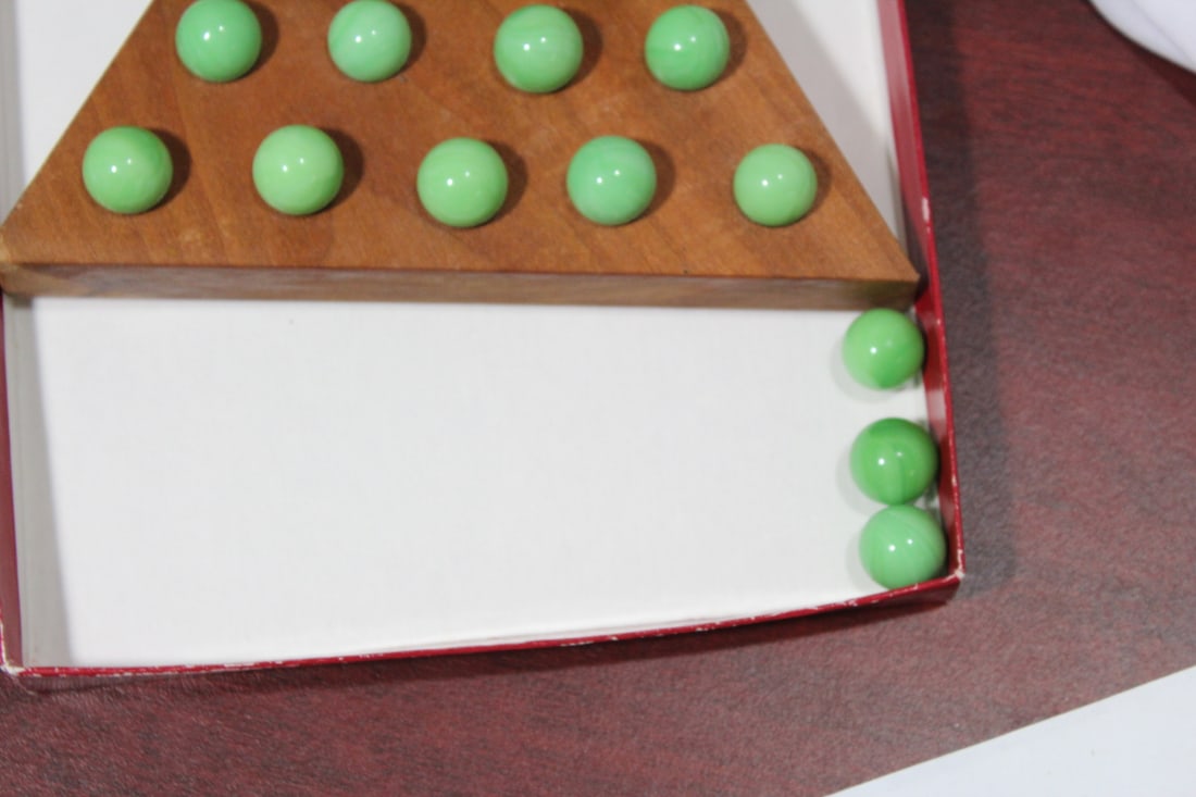 A Triangular Peg Solitaire Game - 3