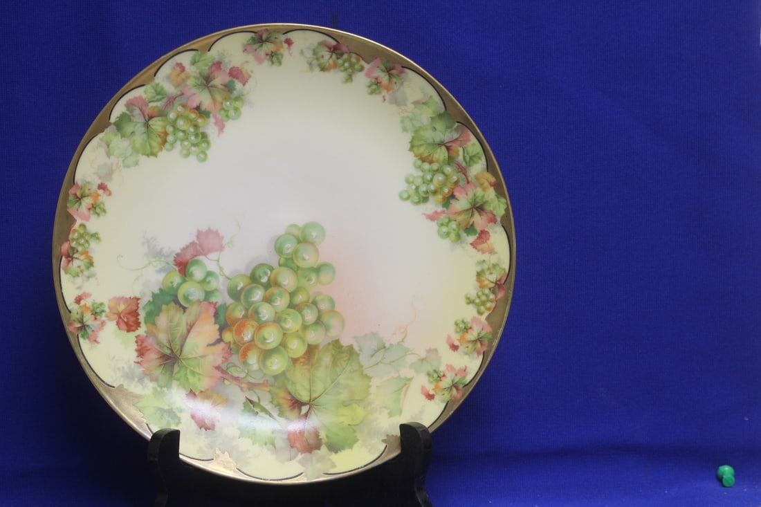 Hand Painted Porcelain Plate: 9 3/8" in diameter - marked on the bottom