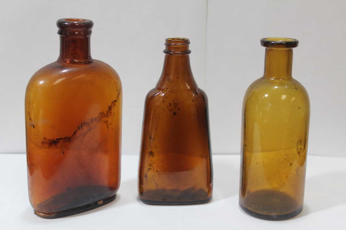 Lot of 3 Amber Glass Bottles: vintage to antique - tallest= 6 1/8" tall
