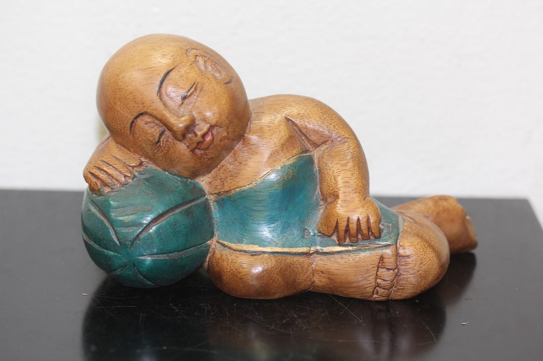 A Wooden Carved Chinese Sleeping Boy: 6" across