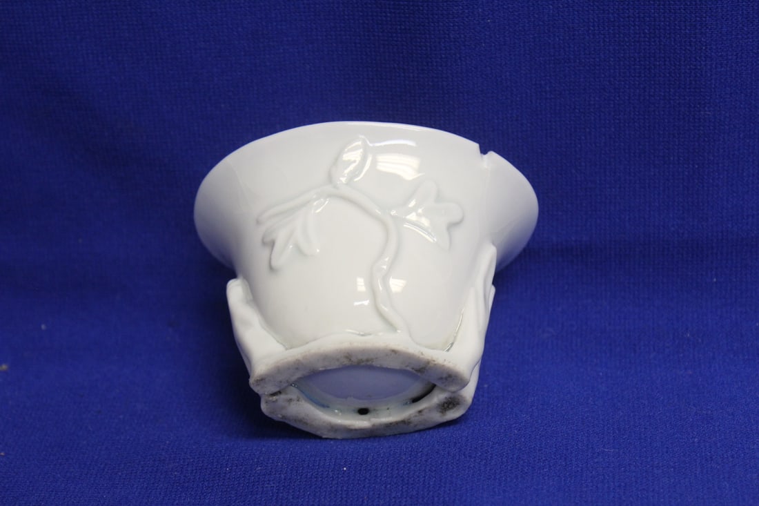An Antique Blanc de Chine Libation Cup: Chinese 18th or 19th century - please note: chip - 3 3/8" across