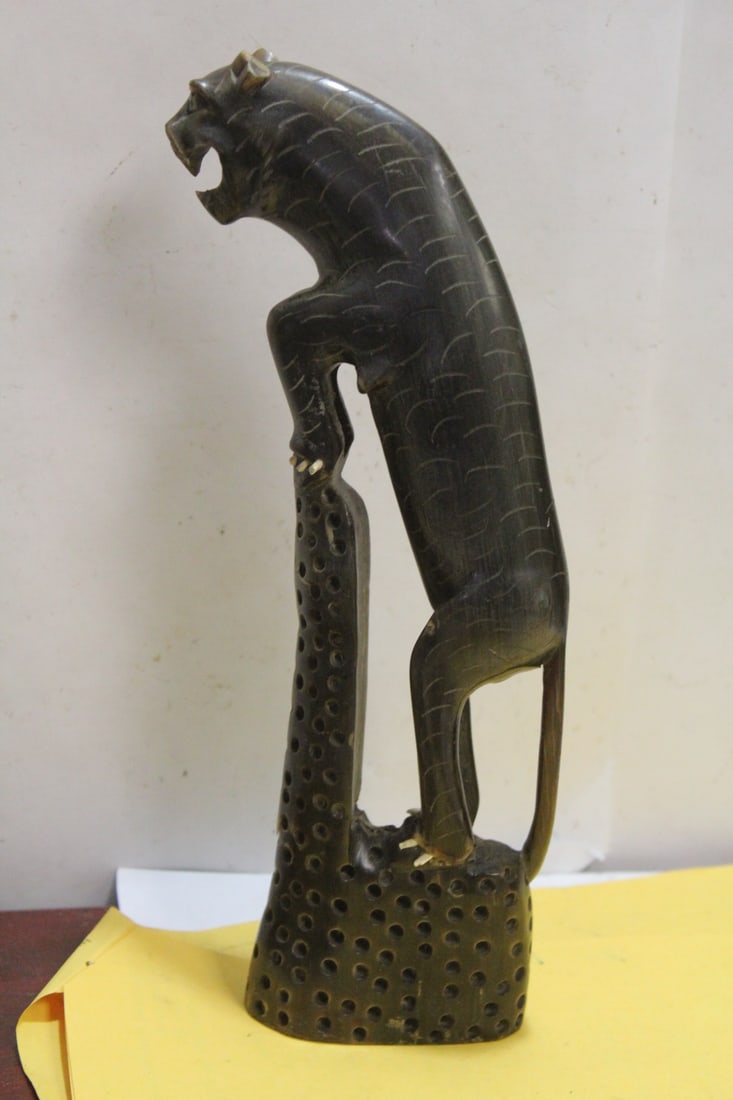 An Antique/Vintage Horn Carving of a Tiger: please note: chip on the mouth and ears - 9 3/4" tall