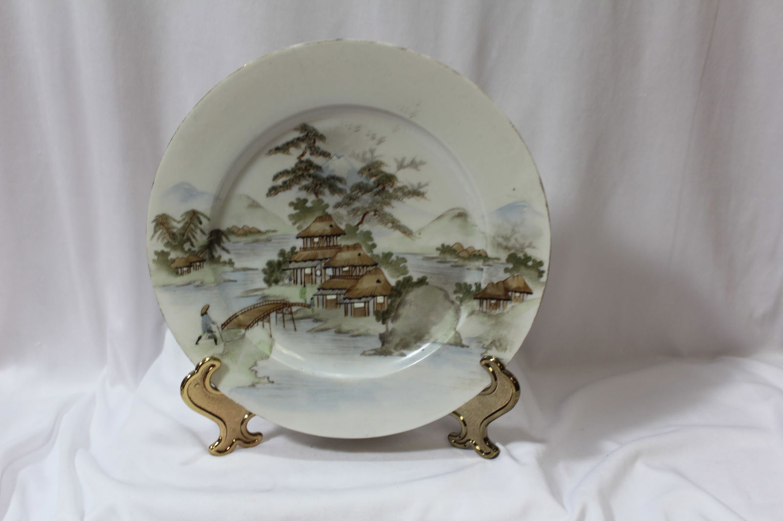 A Japanese Kutani Plate: Artist signed - with museum numbered - 9 1/2" in diameter -please note: hairline