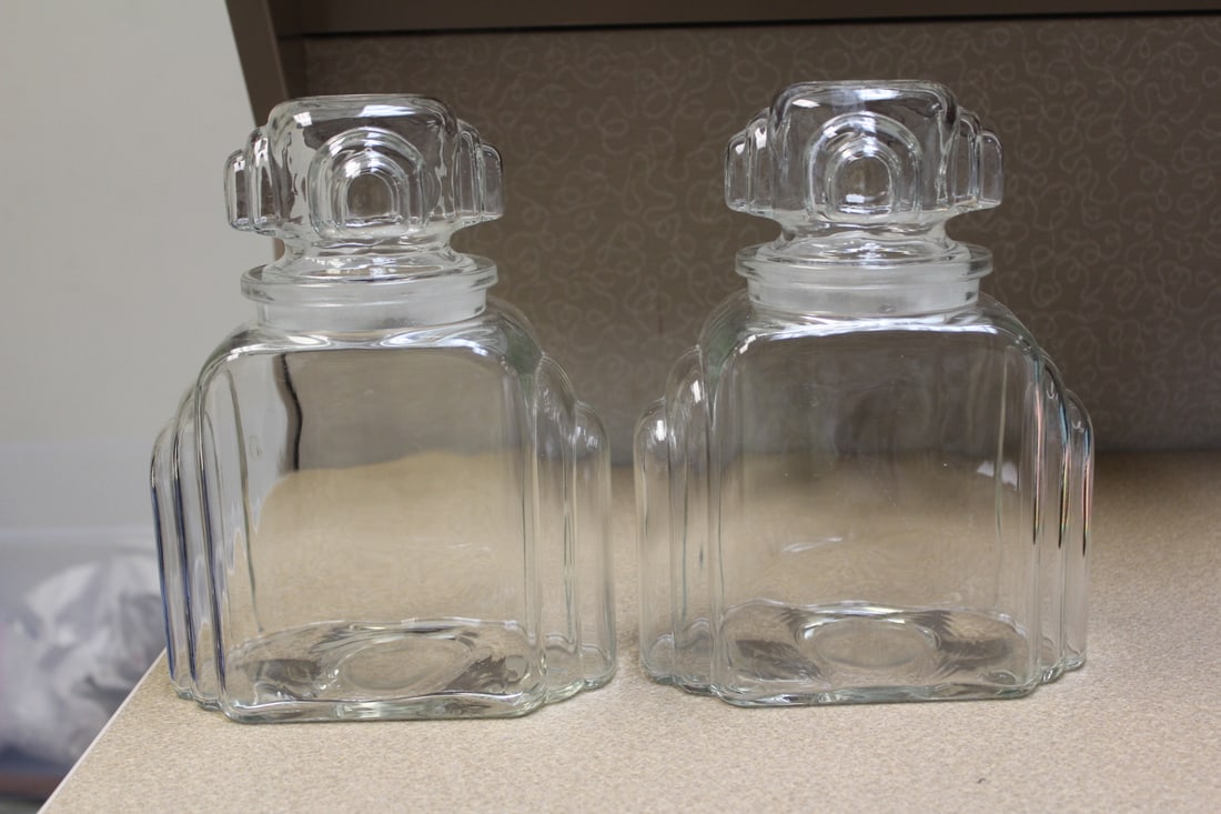 Deco or Deco Style Glass Jars: 9 5/8" tall by 6 3/4" wide - nice looking jars - please note: one stopper has minor underchips, not noticeable when lidded