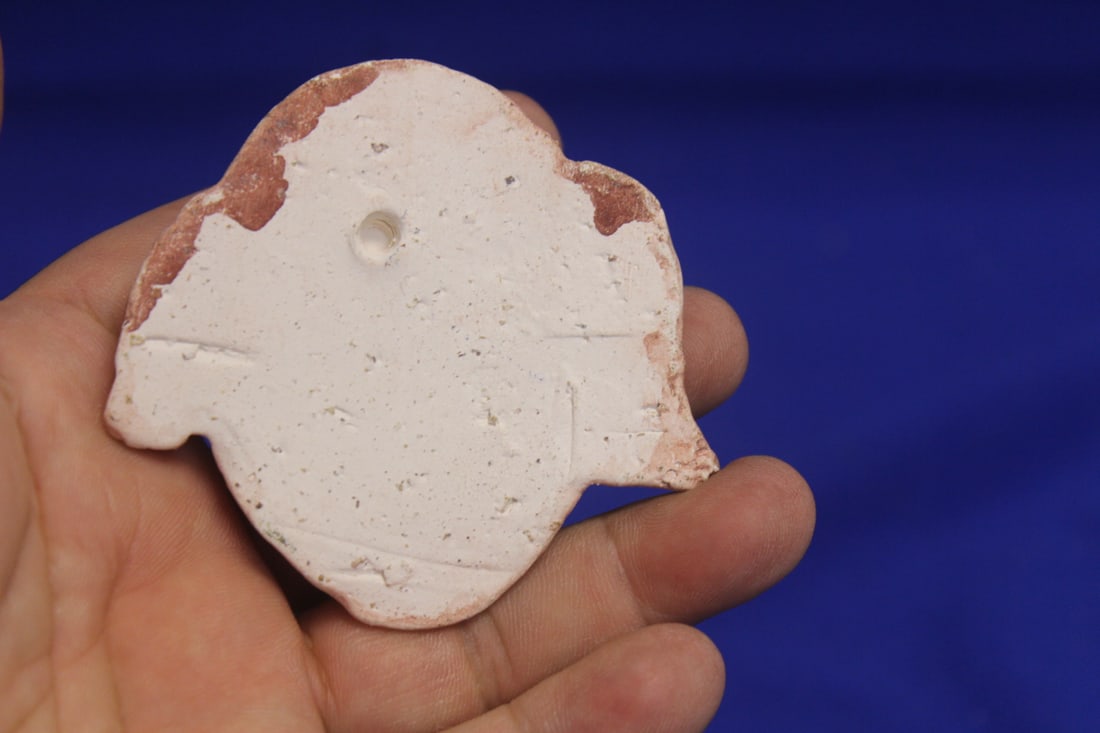 A Small Ceramic Face - 2