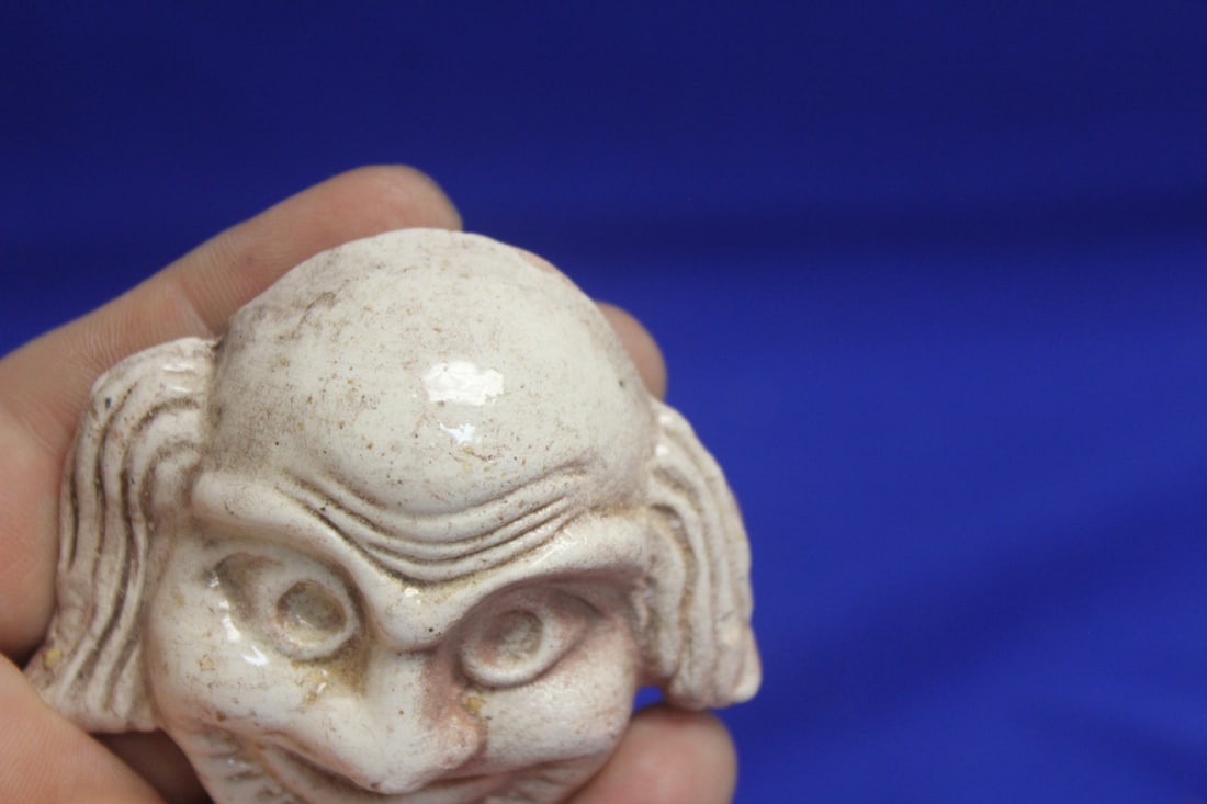 A Small Ceramic Face - 3