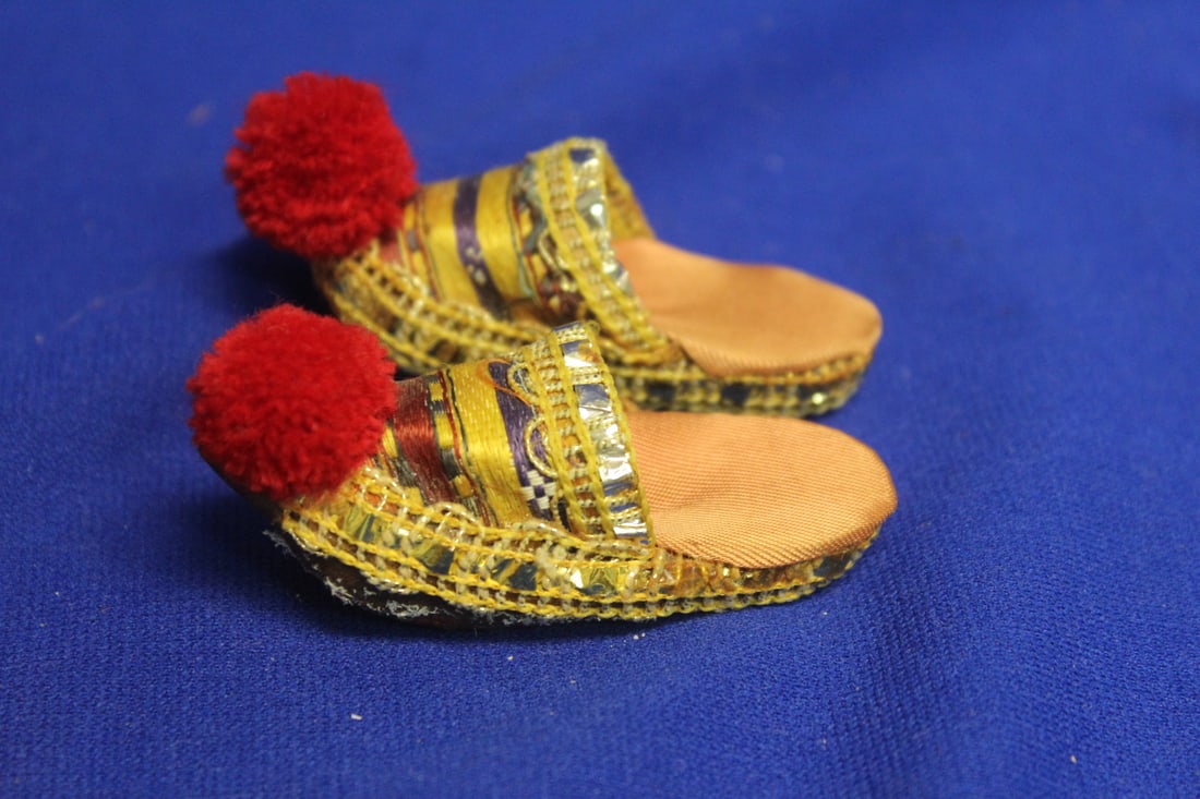 A Miniature Pair of Shoes: Leather and Possibly silk - 2 7/8" across