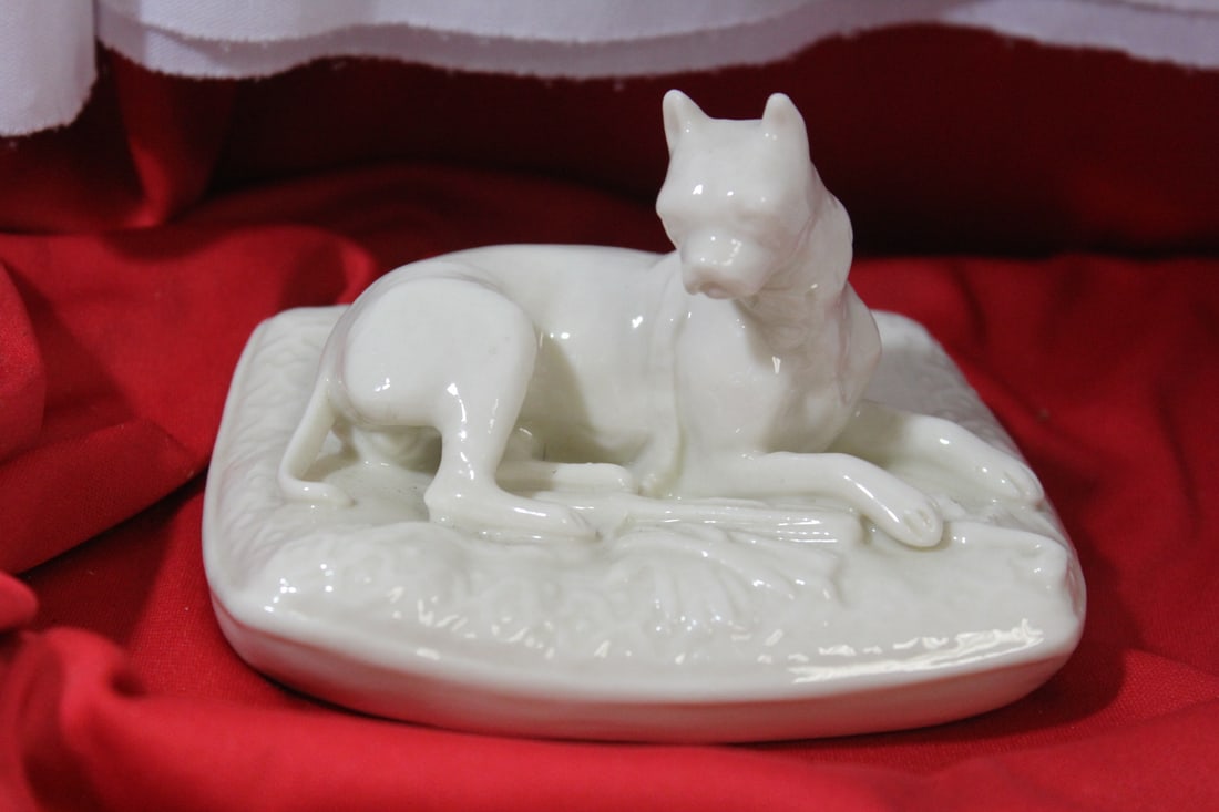 A Belleek Dog: 4 3/4" across