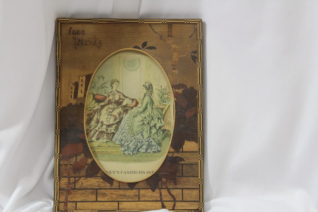 An Old Inlaid Wood Frame: overall= 7 3/4" x 5 3/4" - oval part= 5" in diameter