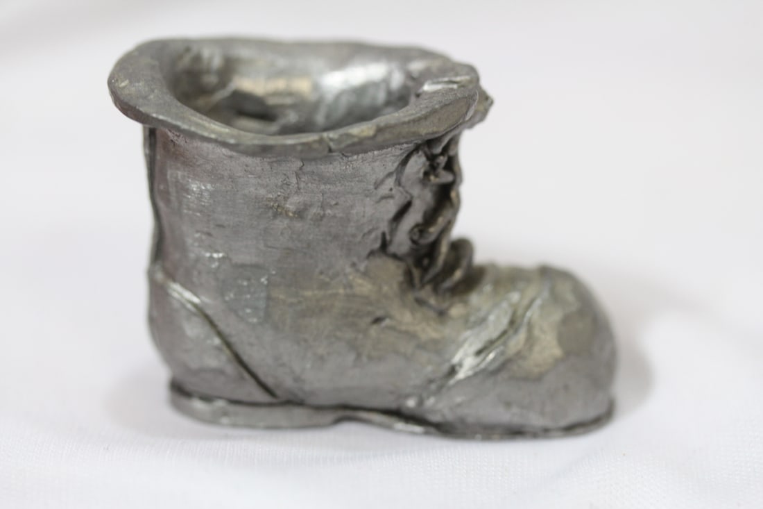 A Miniature Pewter Shoe: solid pewter - 1 3/4" across
