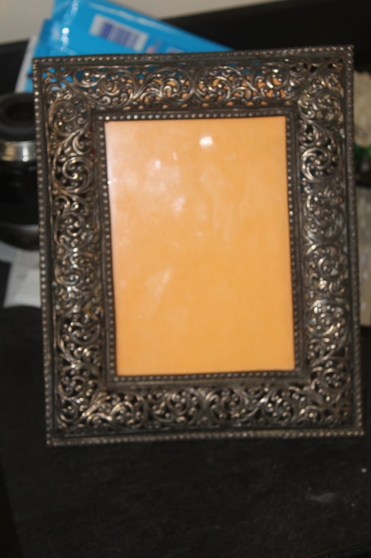Antique High Grade Silver Photo Frame: early 20th century - marked silver - tested as high grade silver - overall= 7 3/4" x 6 3/8" - can fit a 5" x 3" photograph - estmate weights between 9 to 10 ounces
