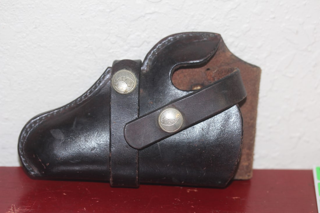 A Hunter Leather Gun Holster: 6" across