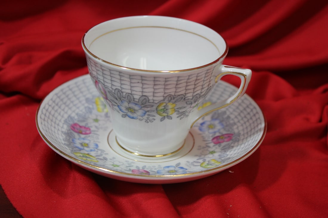 A Rosina Teacup and Saucer: made in England - cup= 2 3/4" tall