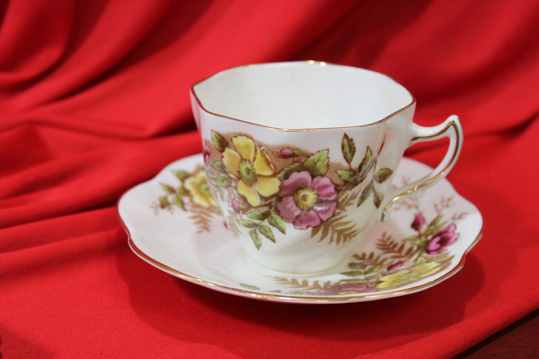 An English Rosnia Bone China Cup and Saucer: cup= 2 3/4" tall