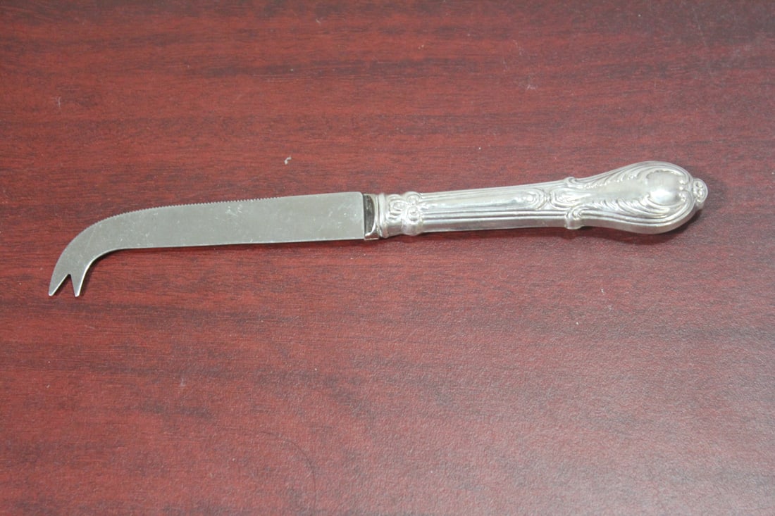 A Stainless Steel Sheffield Knife: Ornate sterling handle - 8 1/4" long