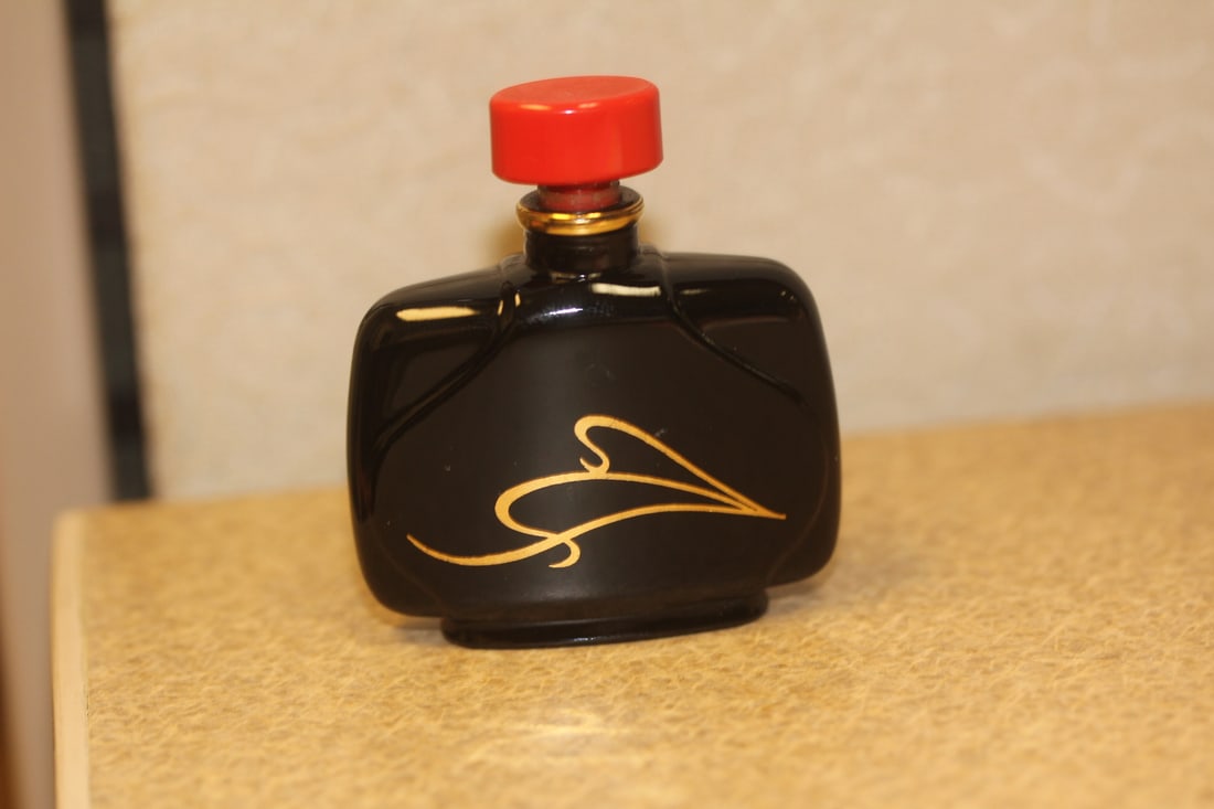 small perfume bottle: some perfume in it