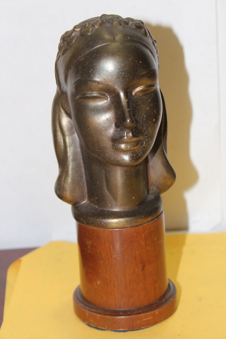A Metal Bust on a Wood Stand: 8 1/2" tall