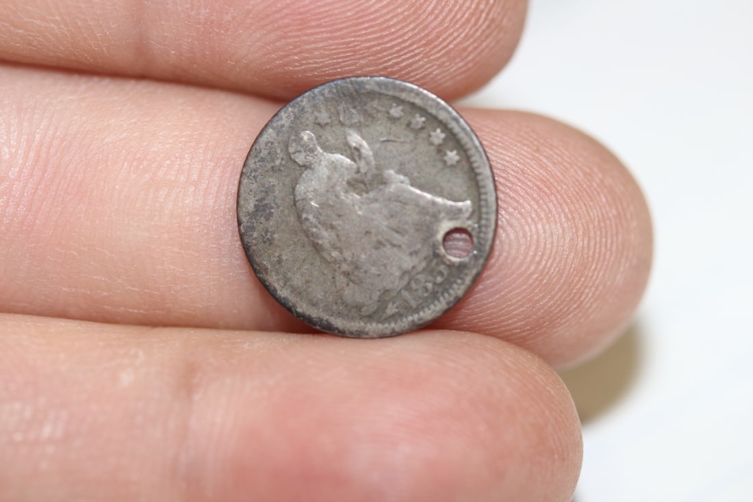 A Silver Half Dime: please note: hole