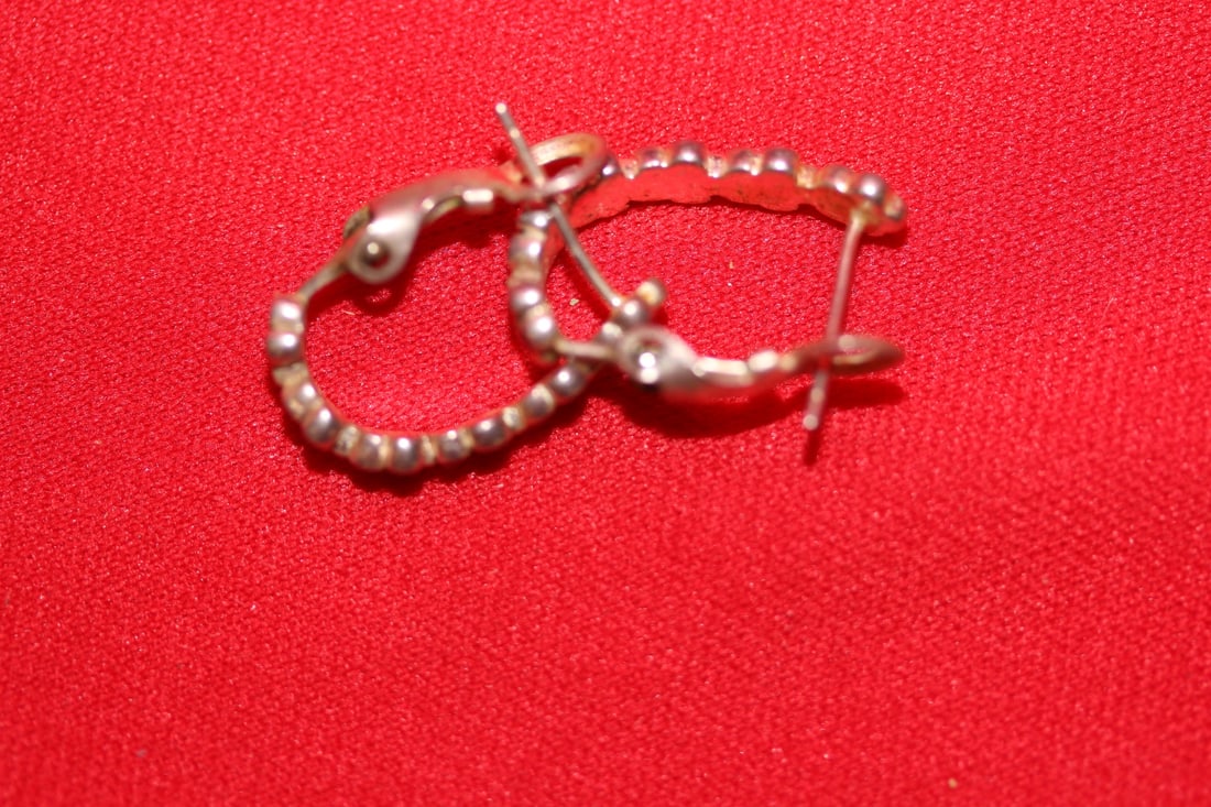 A Pair of Sterling Earrings: as seen on photos