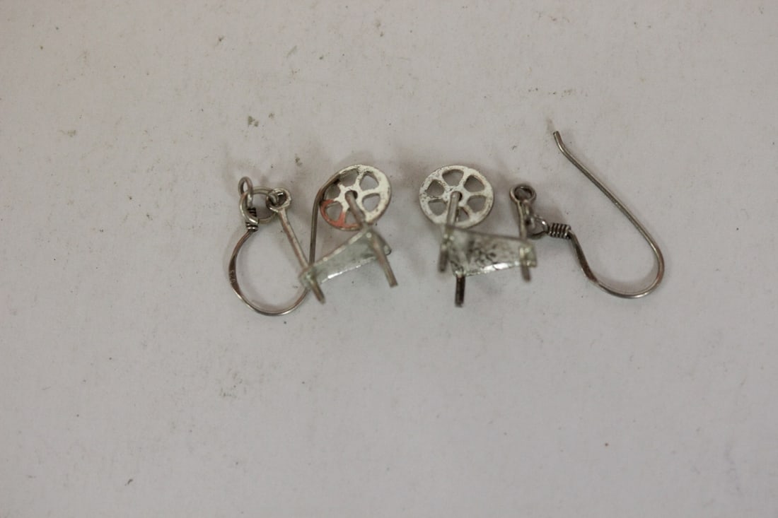 A Pair of Sterling Earrings: as shown