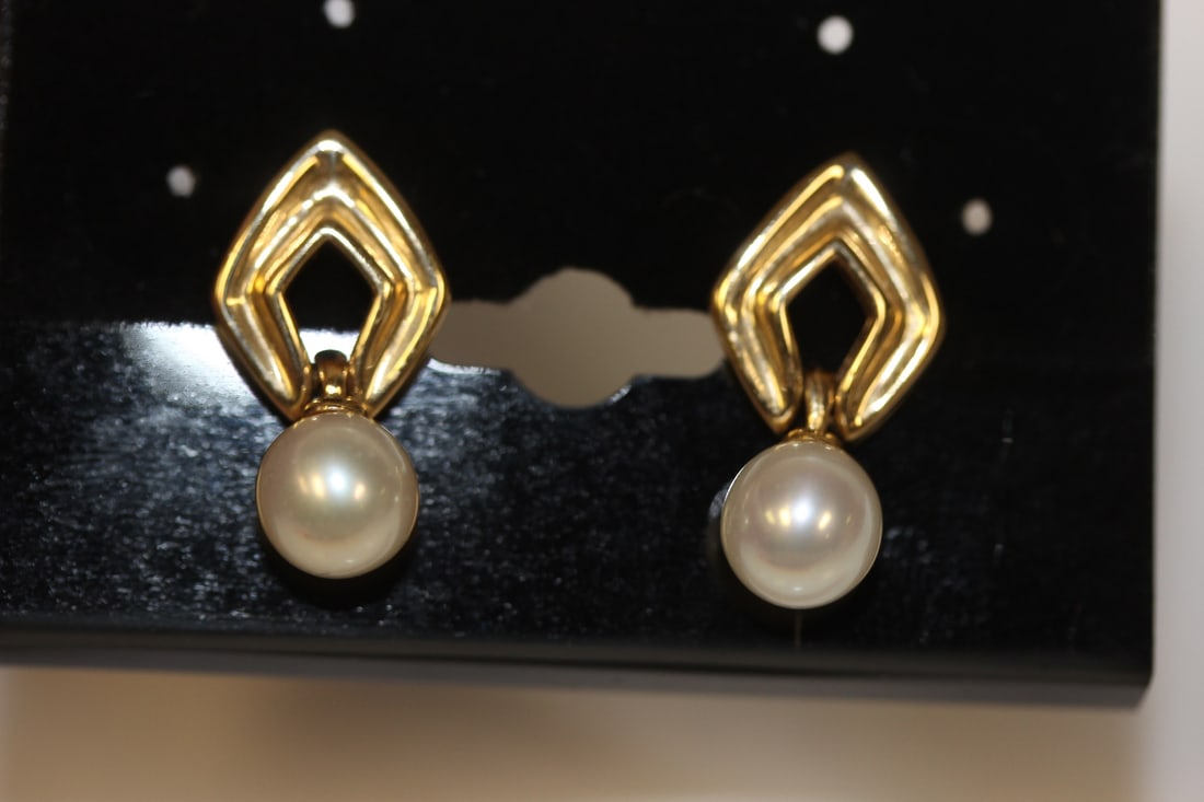A Pair of 14 Karat Gold Earrings: as shown