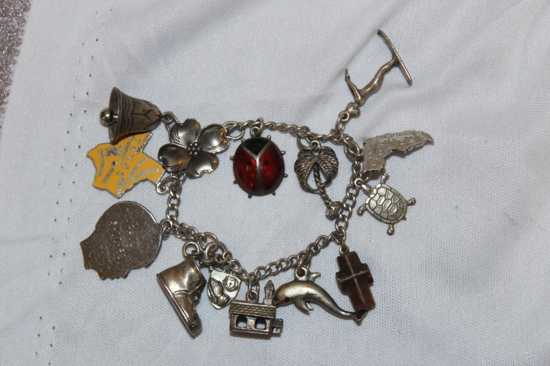 Sterling Charms and Sterling Bracelet: please note: one of the charms is wood