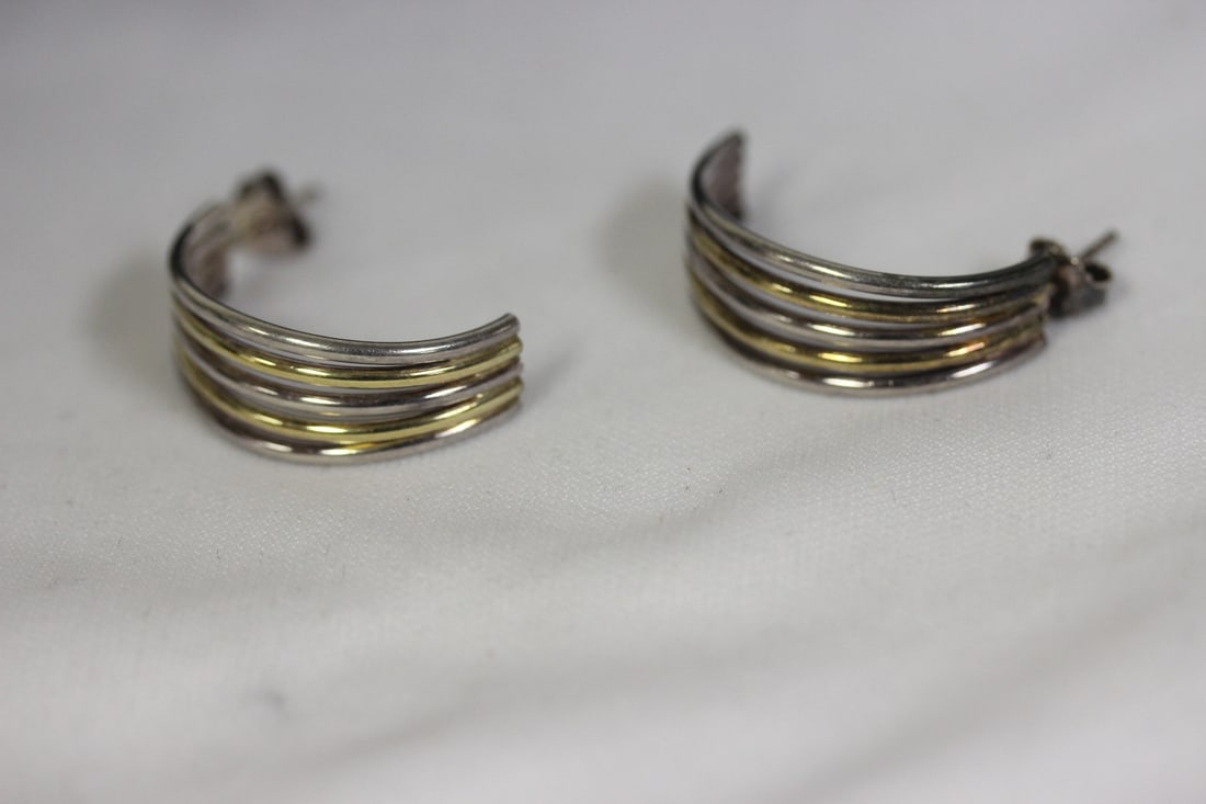 A Pair of Sterling Earrings: two tone