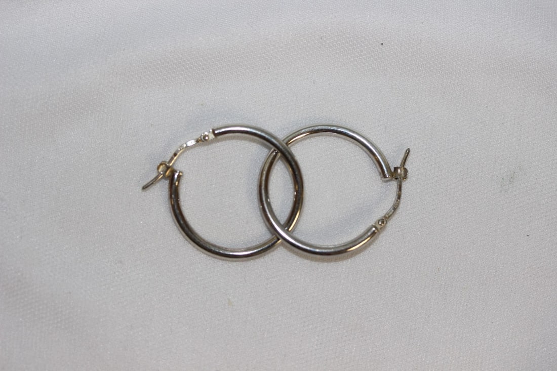 A Pair of Sterling Earrings: as shown