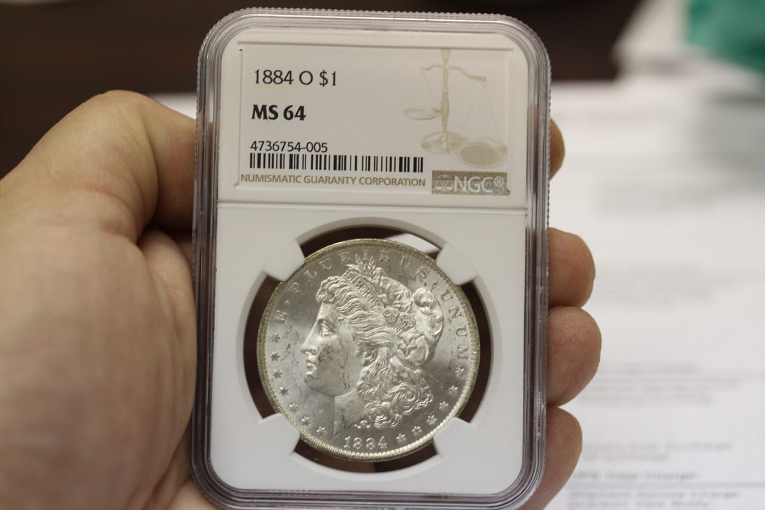 An NGC Graded 1884-O Morgan Silver Dollar (1 of 5)