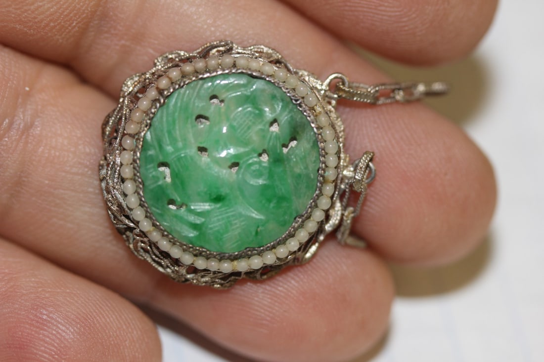 A Vintage Chinese Apple Gren Jadeite Disc: on pearl and sterling holder - probably was once a bracelet - appears to be natural