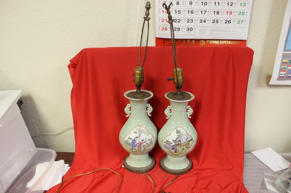 A Pair of Chinese Celadon Vases: 19th century -very detailed - unfortunately chips and drilled as lamps - vase= 11 1/2" tall