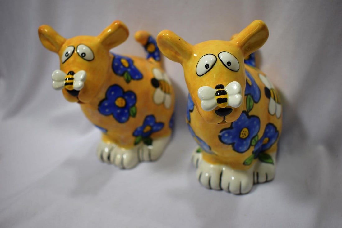 A Pair of Ceramic Cow Bank: 6 1/4" tall each - please note: one has no stopper