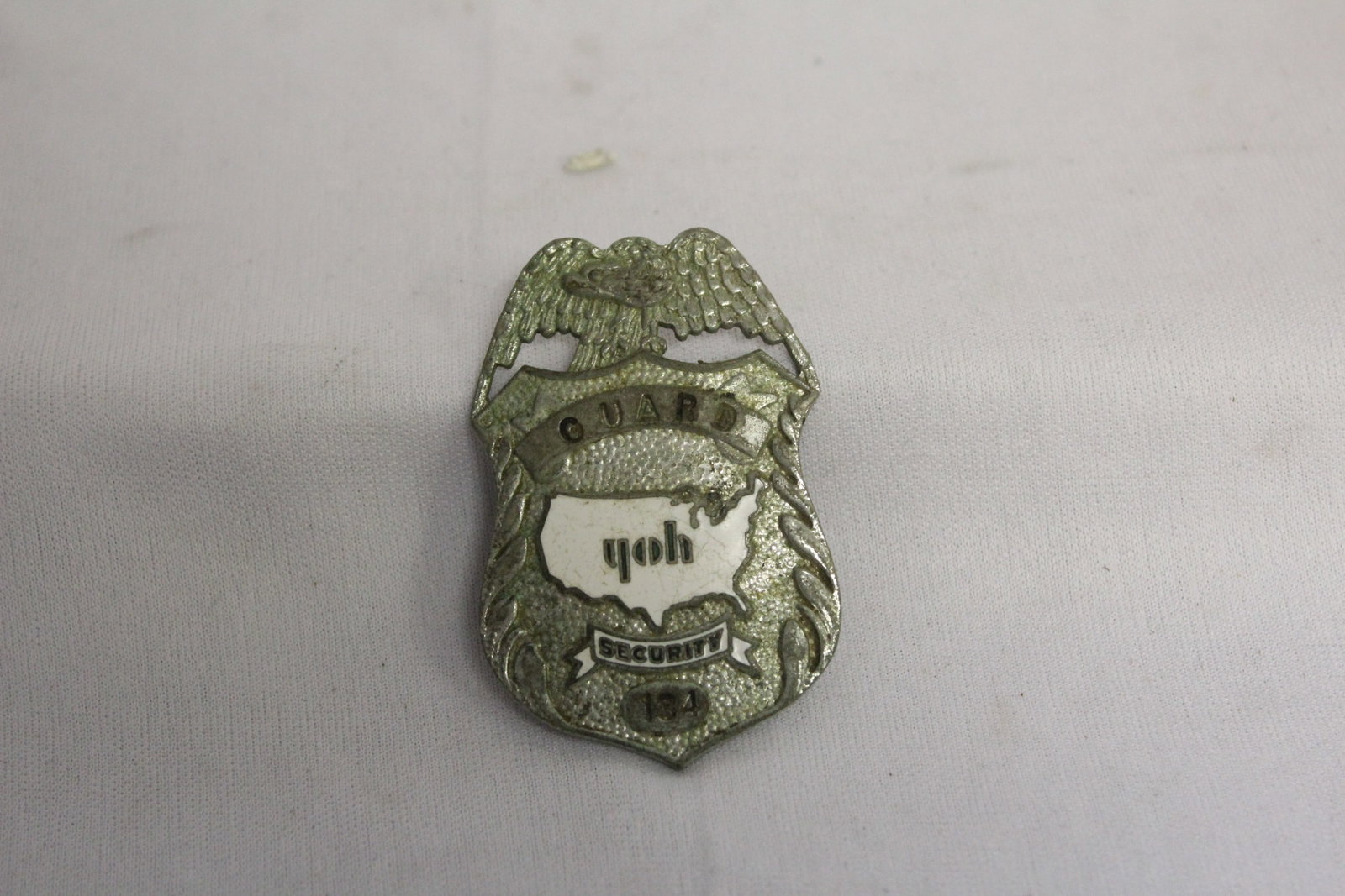 A Security Guard Badge: as shown