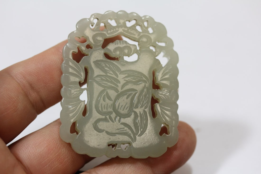 A White Jade Pendant: carved on both side - 2 1/8" in diameter