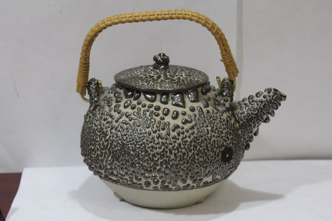 A Vintage Japanese Teapot: ceramic - 8 inches across, from spout to the body