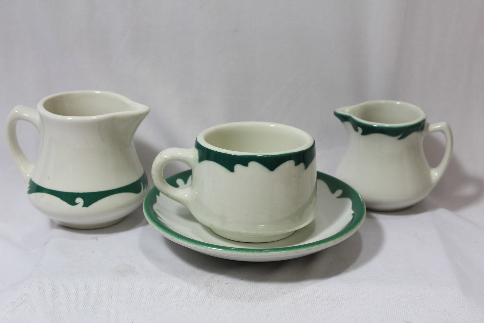 A Set of 4 Ceramic Items: please note: similar pattern, but different manufacturer - tallest= 3 1/2"