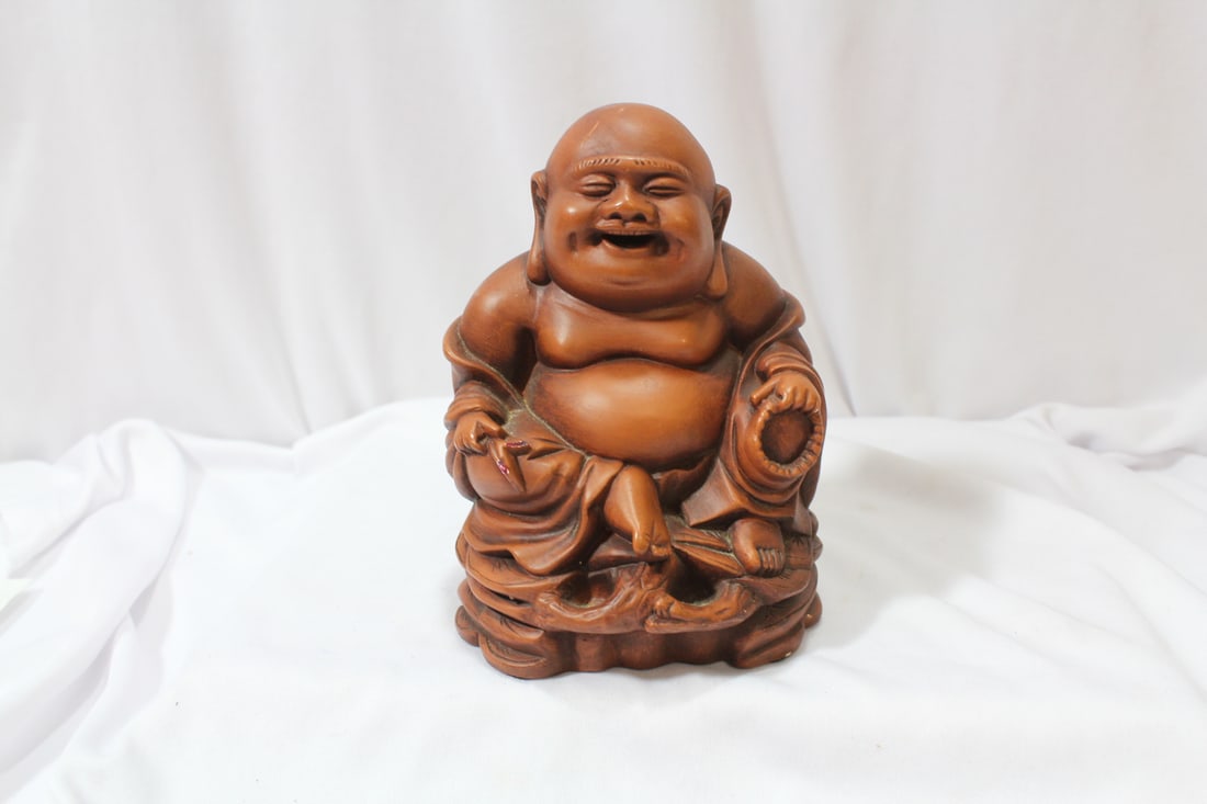 A Buddha Figurine: most likely plastic or chalk - 6 1/4" tall