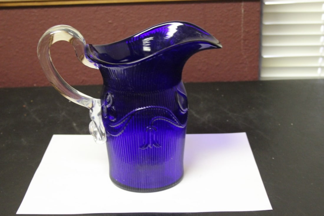 An MMA Glass Pitcher: 7 3/4" tall